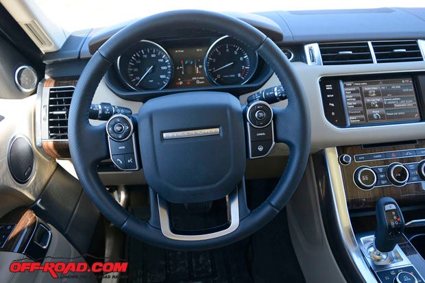 The steering wheel controls on the Sport are easy to use while driving, and the blend of analog instruments and a center digital display make for a nice package.