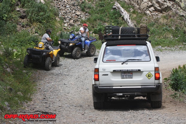 On-trail traffic in Colorado means regular interaction of OHV and truck (here, dropping down from the Virginius Mine in 2012). The same should be easy in-town, where there are lanes and curbs, which are more traffic-friendly than rockchucks and cliffs.