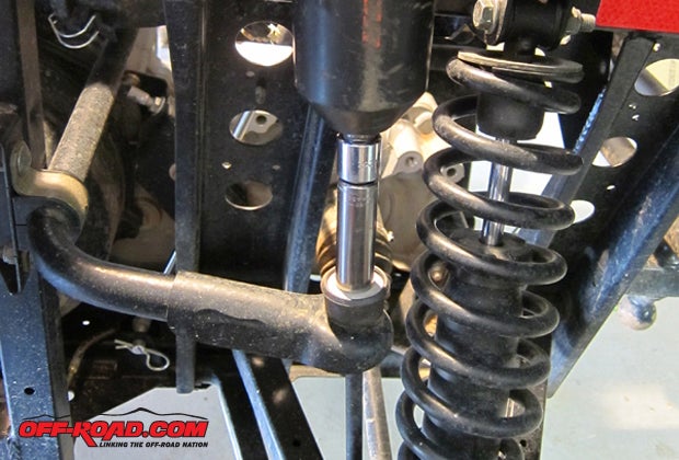 Turning our attention to the rear of the machine, it was a similar process as the front but with two parts instead of only one. The sway bar nut is removed so the bolt extension can be installed, but wait until the shock bracket is fixed in place on both sides before adding this part.