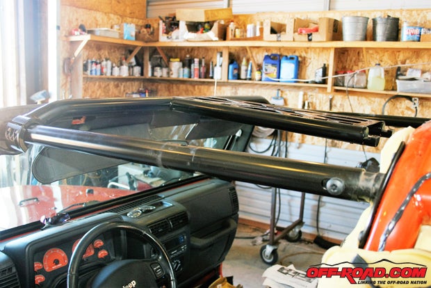 The overhead console bars and the front cross bar are installed as one piece.