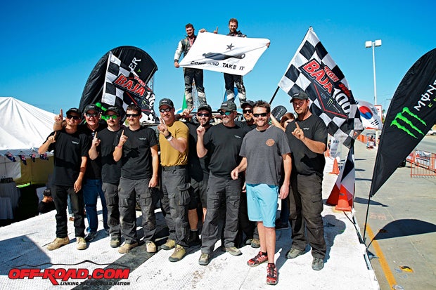 The team celebrates its hard work at the finish line, and both trucks were able to complete the 2014 SCORE Baja 1000 and earn class championships as well. 