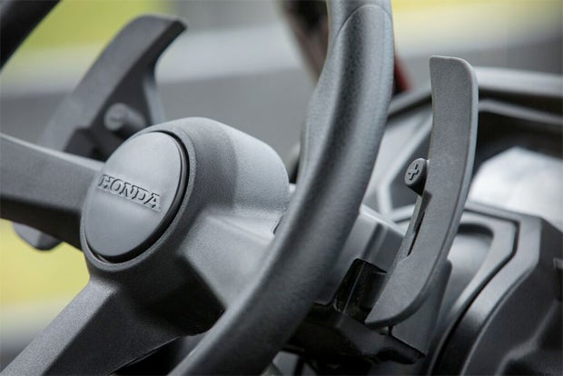The Pioneer 1000's dual-clutch transmission can be controlled via paddle shifters that reside just behind the steering wheel.