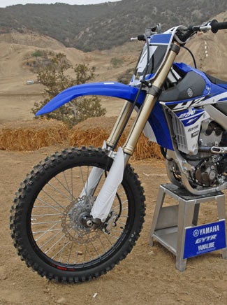 The YZ250F will keep its KYB Speed Sensitive System fork, but Yamaha engineers have retuned it with more compression damping and more oil. The 250mm wave rotor front brake is the same as last year, but the black Excel rims are new.